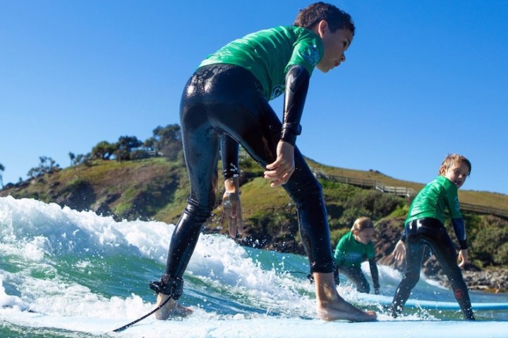 a man riding a wave on a surfboard in the water