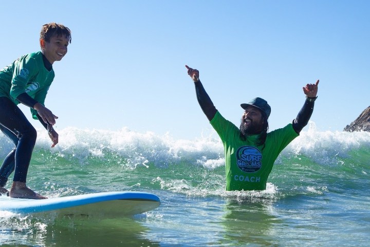 a man riding a wave on a surfboard in the water