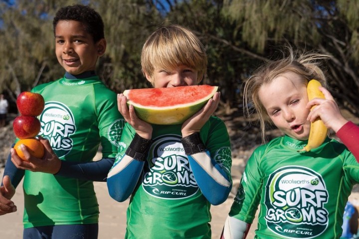 a little boy that is holding a frisbee