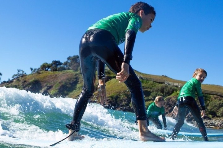 a man riding a wave on a surfboard in the water