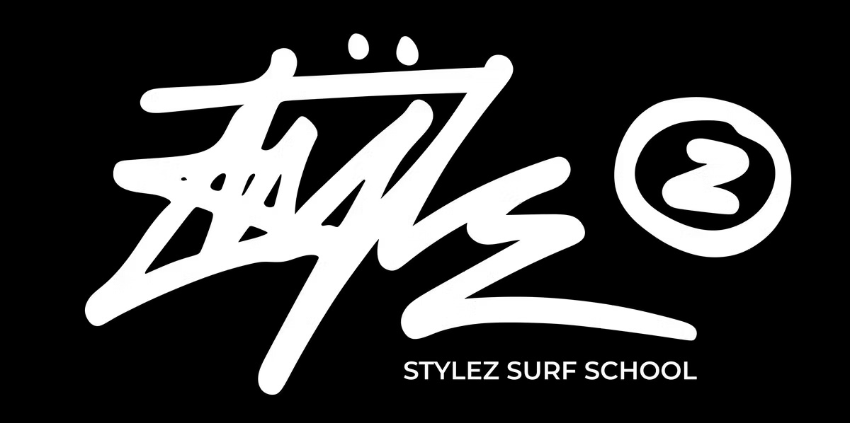 Stylized logo with 'Stylez Surf School' text on a black background.